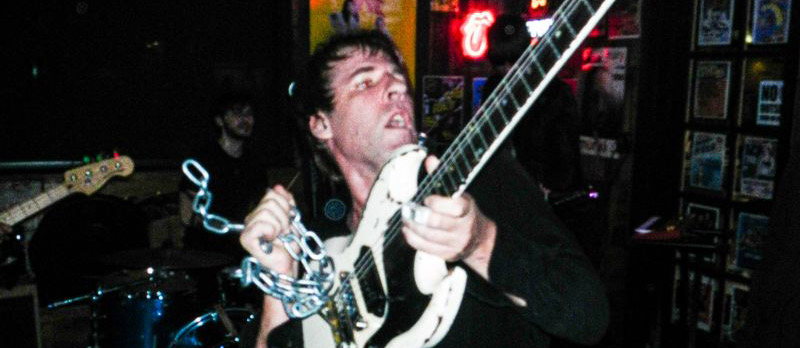Musician playing bass guitar during a live performance